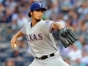 Texas Rangers starter Yu Darvish pitches against the New York Yankees during a game at Yankee Stadium July 23, 2014. (Brad Penner/USA TODAY Sports)