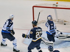Michael Hutchinson lets in one of four goals on seven shots during a loss to the Blues on Tuesday night.