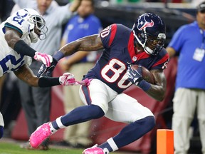 Houston Texans receiver Andre Johnson (80) get knocked out of bounds after making a catch by Indianapolis Colts cornerback Vontae Davis at NRG Stadium. (Matthew Emmons/USA TODAY Sports)