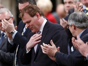 Canada's Foreign Minister John Baird receives a standing ovation before announcing his resignation in the House of Commons on Parliament Hill in Ottawa Feb. 3, 2015. He will step down as an MP March 16. (REUTERS/Chris Wattie)