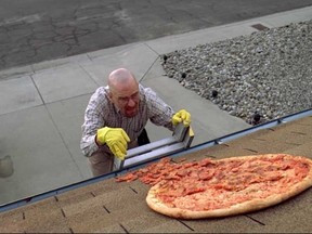 Walter White (played by Bryan Cranston) finds a pizza on his roof in Breaking Bad. (Handout photo)