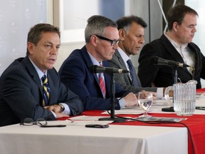 From left, panelists Allan O'Dette, president and CEO of the Ontario Chamber of Commerce; Glenn Vollebregt, president and CEO of St. Lawrence College; Hassan Yussuff, president of the Canada Labour Congress; and Jim Stanford, economist with Unifor in Kingston, Ont. on Wednesday March 11, 2015 at The Good Jobs Summit hosted by the college's HR students. (Steph Crosier/The Whig-Standard)