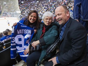 Audrey Watson, 92, is presented with a Leafs jersey from Leafs alumni Wendel Clark during a break in 3rd period action as the Toronto Maple Leafs host the Buffalo Sabres at the Air Canada Centre in Toronto Thursday March 12, 2015. With her is grandaughter Julie Tomilson. (Ernest Doroszuk/Toronto Sun)