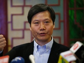 Lei Jun, founder and chief executive officer of China's mobile company Xiaomi Inc, gestures at a news conference which was held as part of the National People's Congress, the country's parliament,  in Beijing March 6, 2015. REUTERS/Kim Kyung-Hoon