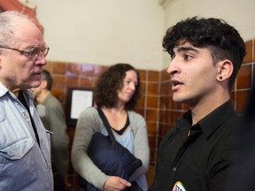 Young homosexual Lebanese immigrant identified only by his first name Nasser, speaks to German filmmaker and gay activist Rosa von Praunheim (L) in the district court Tiergarten in Berlin, March 12, 2015. Nasser accuses his father and uncle of kidnapping and torturing him in an attempt to persuade him to agree to an arranged marriage. (REUTERS/Axel Schmidt)