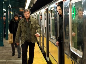 Liam Neeson, left, plays New York hitman Jimmy Conlon who's on the run with his son Mike (Joel Kinnaman, at right) in "Run All Night". (Myles Aronowitz/Warner Bros. Pictures)