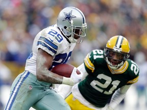 Dallas Cowboys running back DeMarco Murray (29) runs past Green Bay Packers free safety Ha Ha Clinton-Dix (21) in the fourth quarter in the 2014 NFC Divisional playoff football game at Lambeau Field. (Jeff Hanisch-USA TODAY Sports)