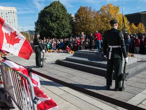 Sentries return to the Tomb of the Unknown Soldier during a ceremony at the National War Memorial in Ottawa October 24, 2014.  Canadian soldier Cpl. Nathan Cirillo was shot and killed at the National War Memorial on October 22,October 24, 2014. Errol McGihon/QMI Agency