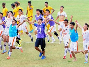 Bhutan players celebrate their win over Sri Lanka in 2018 World Cup qualifying at the Sugathadasa Stadium in Colombo March 12, 2015.  (AFP PHOTO/ISHARA S. KODIKARA)