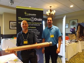 Marc and Daniel of EcoInnovation display a DWHR at DRHBA’s Business Showcase. A Drain Water Recovery System takes heat from the shower drain water to pre-temper incoming cold water before it is heated in the storage tank. This process decreases the amount of gas needed to heat the hot water tank.