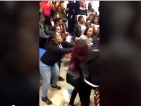 Four teens viciously beat a girl in Brooklyn McDonald's as a surrounding crowd cheers. (YouTube)