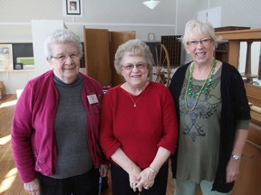 Barbara Stewart, left, president of the Portland District and Area Heritage Society, Irene Bauder, secretary, and Jane Adamson, director, stand inside the old limestone school in Hartington which is being turned into a museum. THURS., MAR 12 2015 KINGSTON, ONT. MICHAEL LEA THE WHIG STANDARD QMI AGENCY