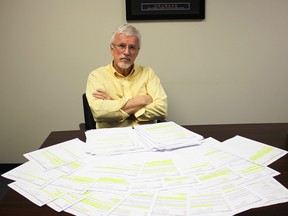 Chatham-Kent Essex MPP Rick Nicholls is pictured Thursday, March 12, 2015 at his Chatham, Ont. constituency office with the numerous e-mails and letters he has received supporting him for standing up against evolution, which resulted in the Progressive Conservative member being criticized by Ontario Liberals and many in the media. (Ellwood Shreve, The Daily News/QMI Agency)
