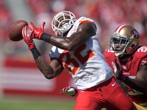 Kansas City Chiefs receiver Dwayne Bowe (82) is defended by San Francisco 49ers cornerback Perish Cox (20)during NFL play last season at Levi's Stadium. (Kirby Lee/USA TODAY Sports)