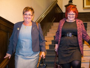 Bonnyville-Cold Lake MLA Genia Leskiw (left) and Fort Saskatchewan-Vegreville MLAs Jacquie Fenske (right) leave a Progressive Conservative caucus meeting at Government House in Edmonton, Alta., on Wednesday, Jan. 28, 2015. Ian Kucerak/Edmonton Sun