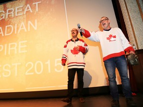 Mark Rashotte, left, and Andy Forgie, sing the national anthem before announcing the line-up for this year's Rockfest, which will feature all-Canadian acts, at the Empire Theatre in Belleville, ON., Thursday, March 12, 2015. 
Emily Mountney-Lessard/The Intelligencer/QMI Agency