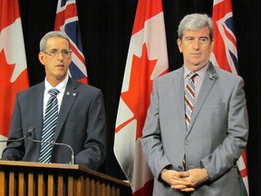 Liberal MPP Grant Crack, left, with Environment and Climate Change Minister Glen Murray, announce Thursday March 12 2015 the legislature will debate his motion to recognize the science and threat of climate change. (Antonella Artuso/Toronto Sun)