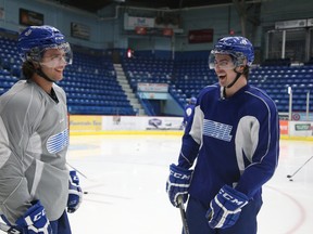 Sudbury Wolves overagers Brody Silk, left, and Jeff Corbett share a laugh at practice Thursday. They'll play their final home game for the Wolves, against former teammate Nathan Pancel and the Peterborough Petes, on Friday at 7:30 p.m. Gino Donato/The Sudbury Star/QMI Agency