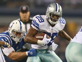 DeMarco Murray of the Dallas Cowboys runs the ball against the Indianapolis Colts in the third quarter at AT&T Stadium on December 21, 2014. (Ronald Martinez/Getty Images/AFP)