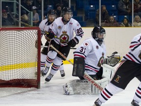 Goalie Andrew Masters keeps his eye on the puck during a third period flurry around his cage Thursday. The Legionnaires lost the contest 5-4 to the LaSalle Vipers. (Submitted photo by Anne Tigwell)