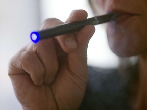 E-cigarette photo illustration. AFP PHOTO / Jim WATSON