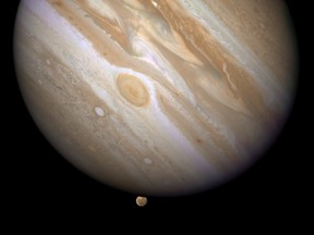 The planet Jupiter is shown with one of its moons, Ganymede (bottom), in this NASA handout taken April 9, 2007 and obtained by Reuters on March 12, 2015. (REUTERS/NASA/ESA and E. Karkoschka/Handout via Reuters)
