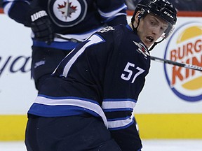 Winnipeg Jets defenceman Tyler Myers watches a shot go past him against the Ottawa Senators during NHL action at MTS Centre in Winnipeg, Man., on Wed., March 4, 2015.