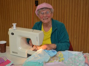Dorothy Kilgour is one of the dedicated women who routinely donate their handiwork, in this case lap quilts for Alzheimer’s patients, to area seniors’ residences. The community sewing bee is held a few times a year at the Melbourne Agricultural Society hall.