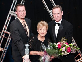 Realtor of the Year Award winner Carolyn Pratt (centre) is flanked by president-elect Steve Sedgwick (left) and past president Greg Steele.