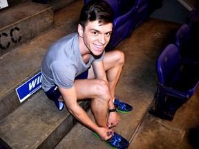 Londoner Chris Balestrini ties his shoes inside Thompson Arena at Western University in London Ont. March 12, 2015. Balestrini is a cross-country runner at Western and an ambassador for the upcoming Forest City Road Races. CHRIS MONTANINI\LONDONER\QMI AGENCY