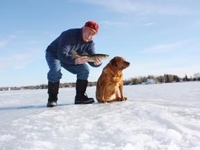 Neil and Penny with a Lac Ste. Anne walleye. (NEIL WAUGH PHOTO)