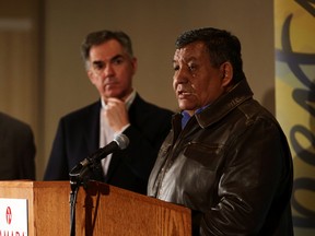 Grand Chief Steve Coutorille (r) with Premier Jim Prentice speaks to the media on the state of schools on reserves during a summit meeting at the Ramada Hotel in Edmonton, Alberta on Friday March 13, 2015. Perry Mah/Edmonton Sun