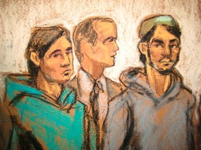 Akhror Saidakhmetov (left) and Abdurasul Hasanovich Juraboev (right) appear with court interpreter Akhror Saidakmetov in New York, Feb. 25, 2015. (JANE ROSENBERG/Reuters)