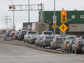 A train stalls Waverley Street traffic on Friday, March 13, 2015. The Waverley Underpass project area at Waverley Street and Taylor Avenue will be closed from Friday, Sept. 29, 2017 at 5:30 p.m., to Monday, Oct. 2 at 6 a.m., to prepare for traffic moving to a new detour road while construction continues.
(FILE PHOTO)