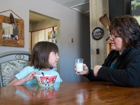 Darelyn Doxtator is teaching her daughter Blondie to speak the Oneida language at home and school. onuhta_? means milk. (CRAIG GLOVER, The London Free Press)