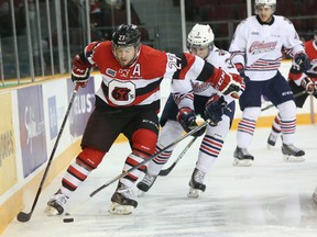 Ottawa 67's forward Brendan Bell protects the puck behind the Oshawa net Friday as the 67's took on the Generals at TD Place. (Chris Hofley/Ottawa Sun)