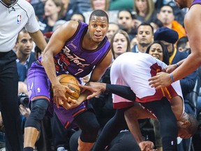 Miami's Dwyane Wade reaches for the ball as Raptors guard Kyle Lowry makes the steal during Friday night's game. (ERNEST DOROSZUK/Toronto Sun)