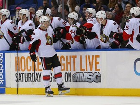 Matt Puempel high-fives teammates after scoring Friday night against the Islanders. (Reuters)
