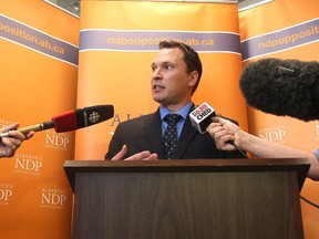 NDP MLA Deron Bilous comments during a press conference at the Alberta Legislature in August 2014. David Bloom/Edmonton Sun