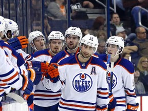Mar 13, 2015; Columbus, OH, USA; Edmonton Oilers right wing Jordan Eberle (14) celebrates his goal with teammates in the second period against the Columbus Blue Jackets at Nationwide Arena. Mandatory Credit: Aaron Doster-USA TODAY Sports