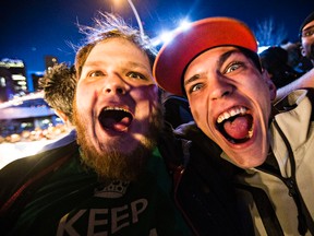 Matt Farvolden, left, and Andre Jodoin, right, show their excitement during the Ice Cross Downhill World Championship season finale at Red Bull Crashed Ice in Edmonton, Alta., on Saturday, March 14, 2015. Codie McLachlan/Edmonton Sun/QMI Agency