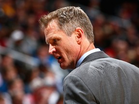 Steve Kerr of the Golden State Warriors reacts after a call during the game against the Atlanta Hawks at Philips Arena on February 6, 2015 in Atlanta, Georgia. (Kevin C. Cox/Getty Images/AFP)