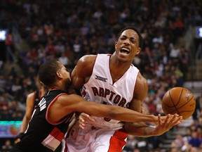 Toronto's DeMar DeRozan gets fouled by C.J. McCollum as Raptors host the Portland Trail Blazers on Sunday night. Michael Peake/Toronto Sun/QMI Agency)