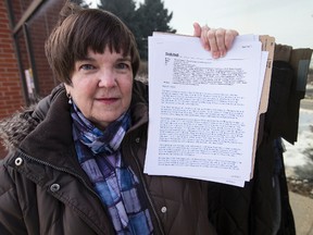 TCH resident Bonnie Booth who holds correspondence -- including legal threats -- she has had with social housing officials. (CRAIG ROBERTSON, Toronto Sun)