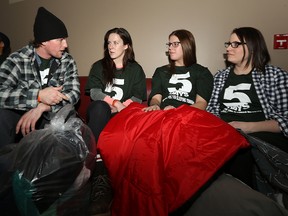 Five Days for the Homeless sleepers Riaz Mahmood, Dale Camuyong, Al Turnbull, Alannah Matte, Karli Kirkpatrick and Deanna Mirlycourtois (from left) chat at the even't opening ceremonies at the Asper School of Business on the University of Manitoba campus on Sun., March 15, 2015. (Kevin King/Winnipeg Sun/QMI Agency)