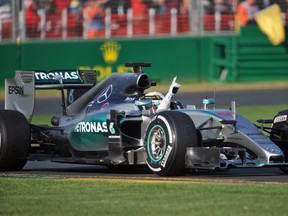 Lewis Hamilton gives the victory salute Sunday after winning the Australian Grand Prix.
