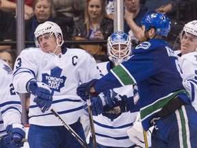 Goalie Jonathan Bernier #45 and Jake Gardiner #51 look on as Zack Kassian #9 of the Vancouver Canucks and Dion Phaneuf #3 of the Toronto Maple Leafs in NHL action on March, 14, 2015 at Rogers Arena in Vancouver, British Columbia, Canada. (Rich Lam/Getty Images/AFP)