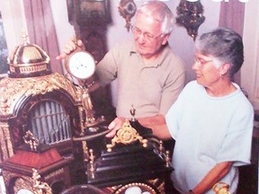 George and Irene Hartwick look at some of the clocks in their collection. (Photo contributed)