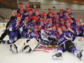 The Western Mustangs women's hockey team celebrate after winning their first-ever CIS Championship March 15, 2015 in Calgary. (Photo courtesy of David Moll, University of Calgary).