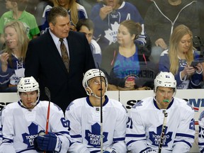 Toronto Maple Leafs interim coach Peter Horachek during a TV timeout against the Calgary Flames in Calgary, Alta. on Friday March 13, 2015. (Al Charest/QMI Agency)